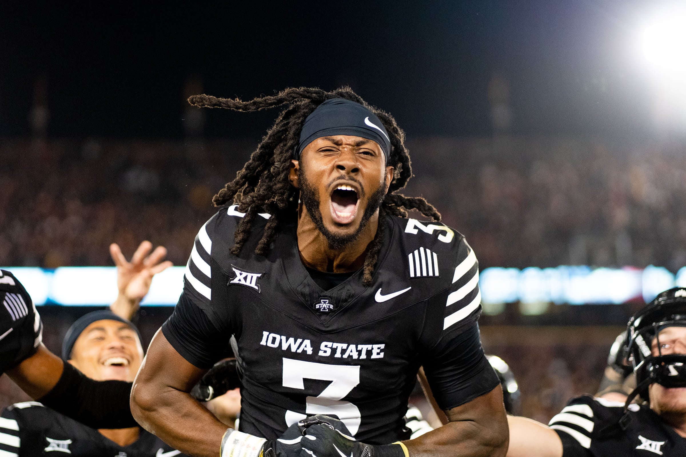 Iowa State football player celebrating and shouting during a game