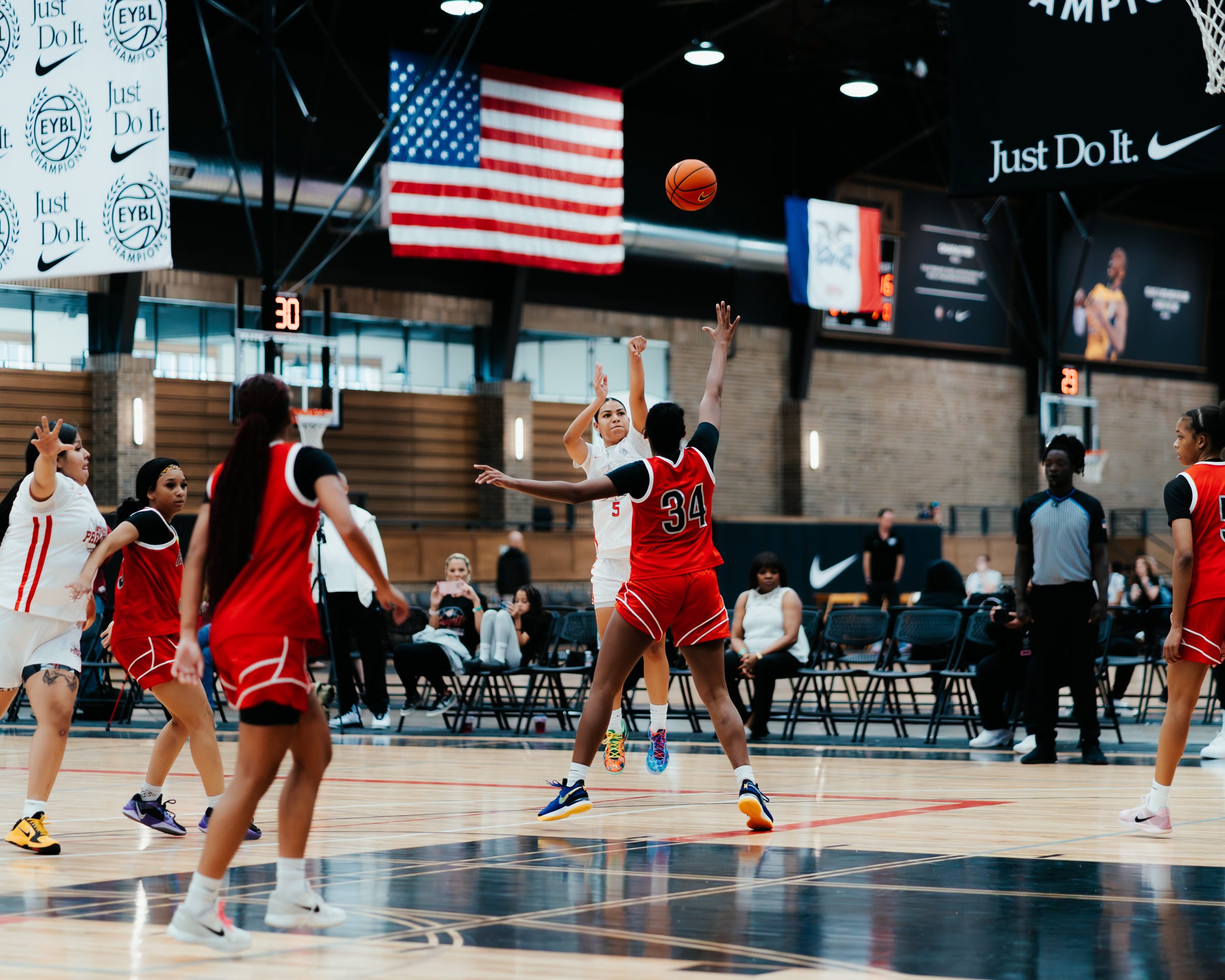 Basketball player shooting a jump shot at an EYBL tournament